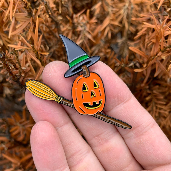 pumpkin witch on broom halloween enamel pin