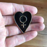 The Venus Heart Shield (Black Heart) Enamel Pin from the Empress card